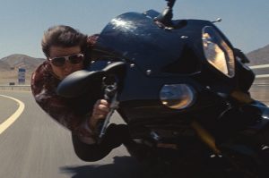 Tom Cruise on a bike wearing soft replica sun glasses